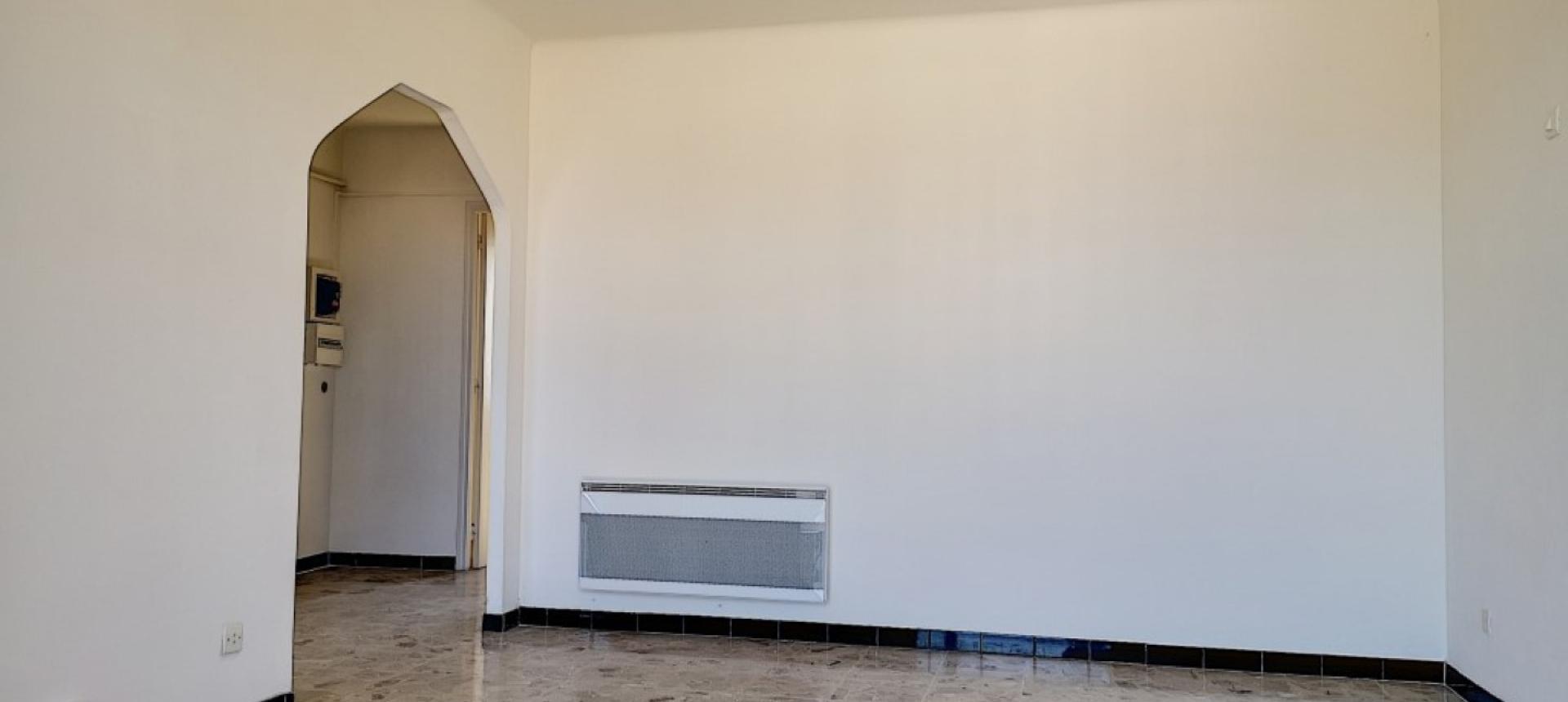 F2 à louer Loretto salle de séjour